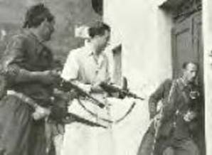 Partisans raiding a home.  Photo Credit Mondadori, Milan